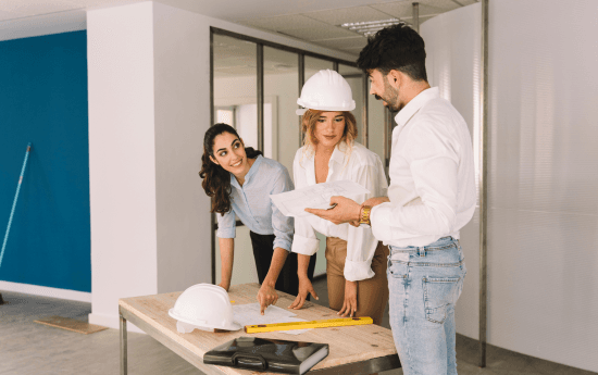 A team reviewing plans on site