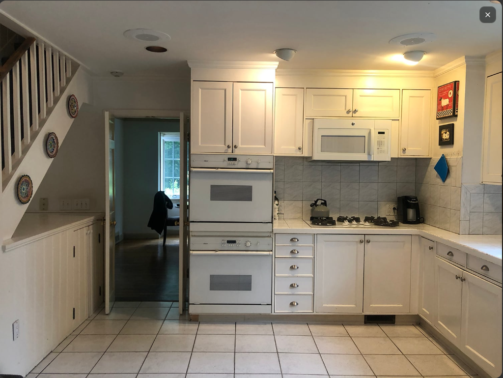 Plain white kitchen before the AI-visualized renovation